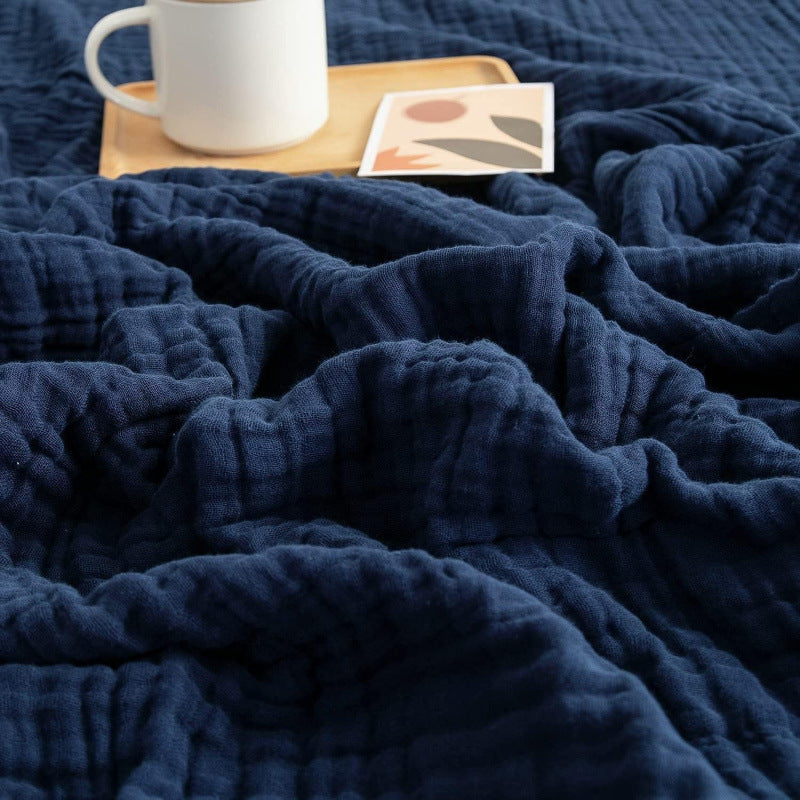 Muslin blanket folded neatly showing size and drape