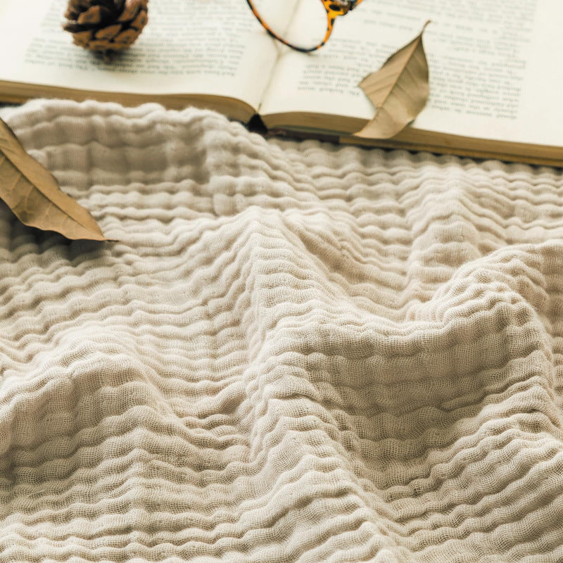 Cotton muslin blanket folded showing multi-layer weave detail