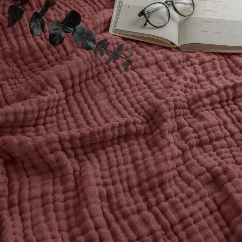 Cotton muslin blanket styled with home decor accessories